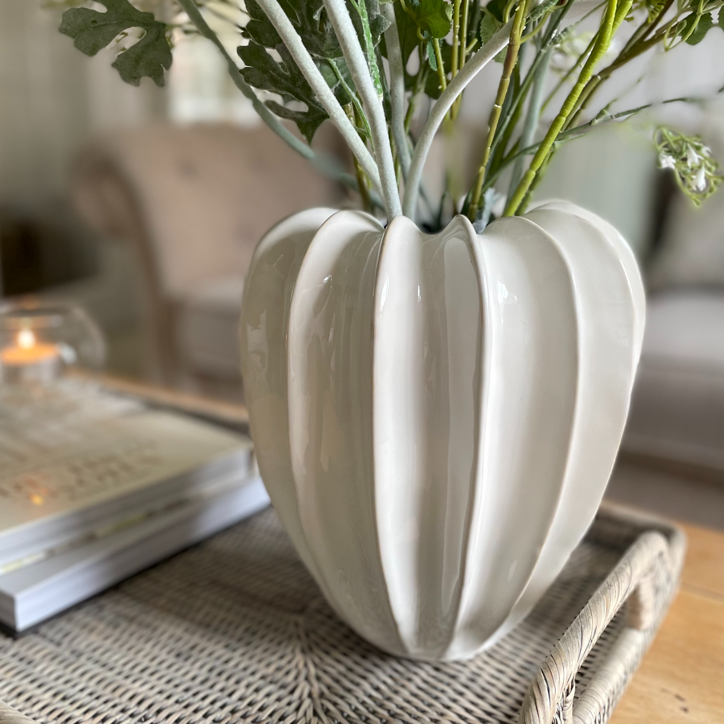 Olivia neutral glazed vase for floral arrangements. Styled on a rattan tray on a coffee wooden table.