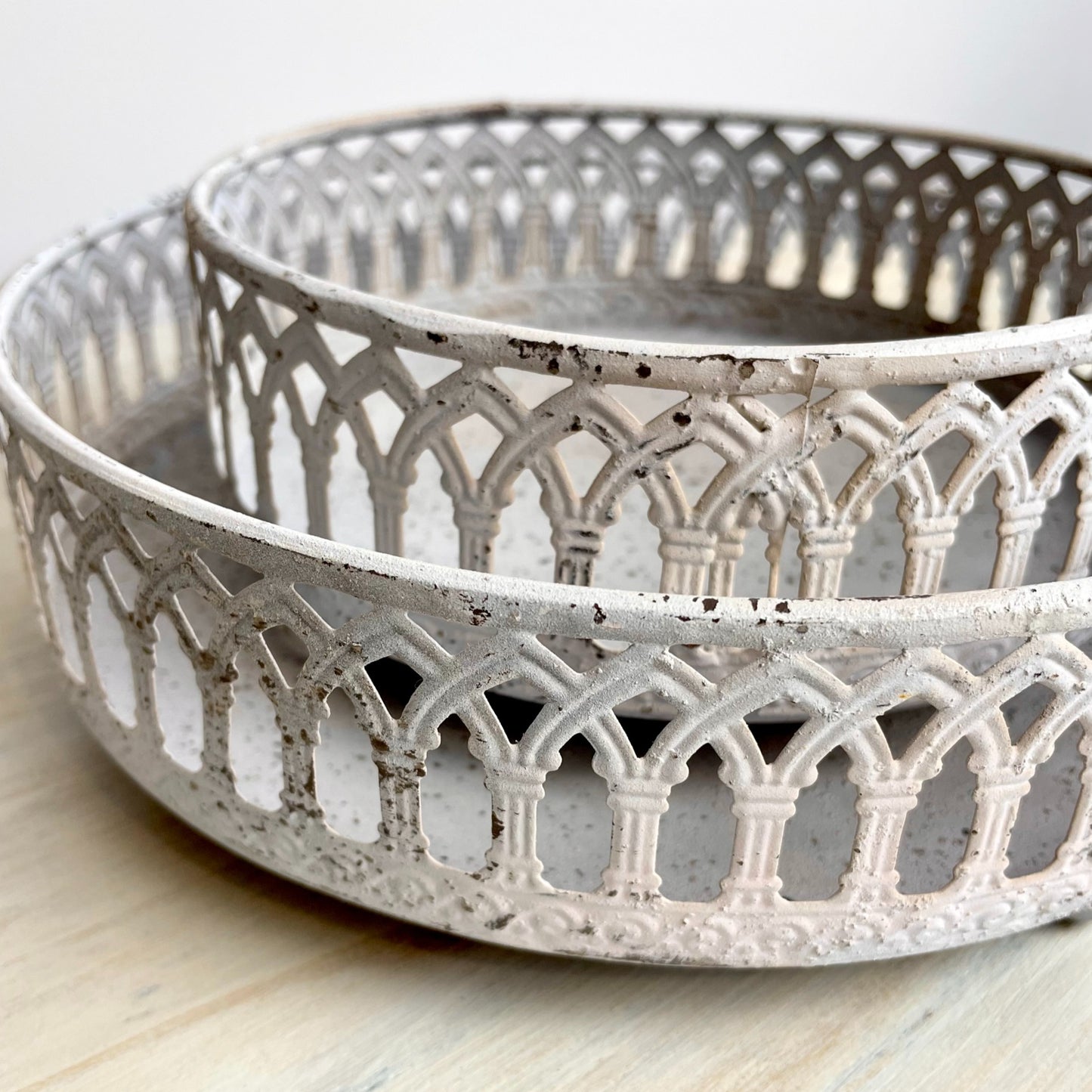 White washed rustic metal trays with detailing.