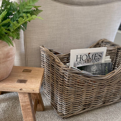 Handmade rattan magazine storage basket with two compartments.