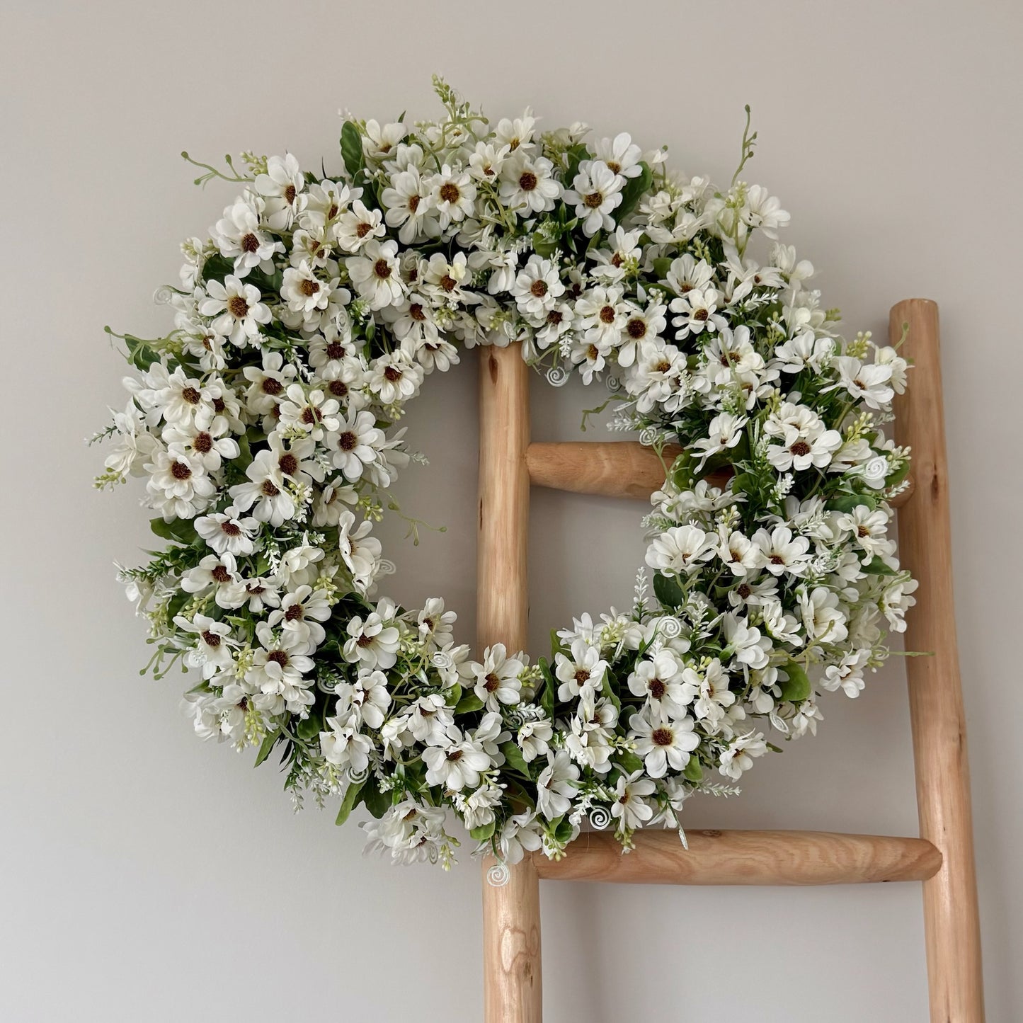 Wild Daisy Wreath featuring faux wildflowers and greenery, UV-protected to maintain colour and beauty outdoors.