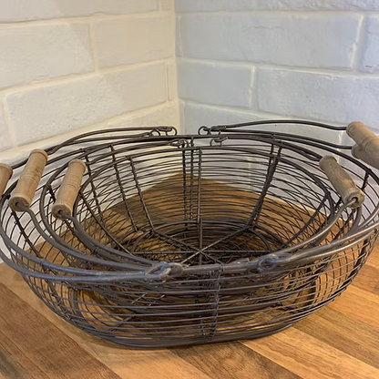 Sturdy metal wire baskets with wooden handles, perfect for storing eggs or small kitchen essentials