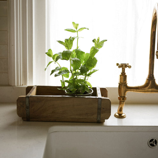 Vintage style wooden brick mould with iron details, showcasing its natural variations in colour and texture for a timeless, rustic look.