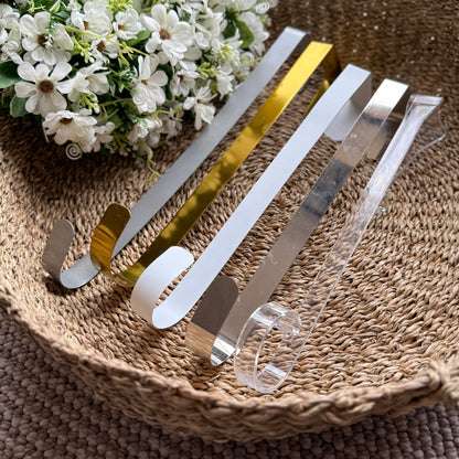 Assorted coloured metal wreath holders displayed together, showcasing their sturdy design and versatile home decor use.