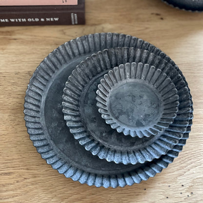 Zinc fluted plates in three sizes available. Candle and plant holders.